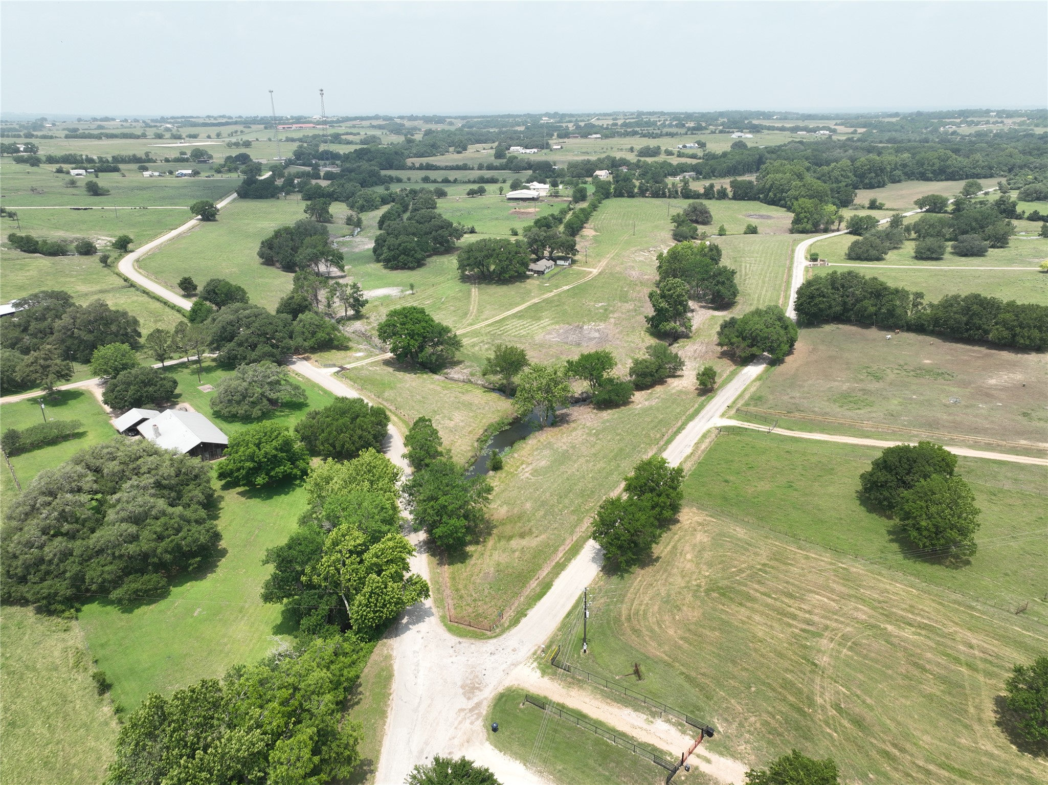 7009 Sandy Hill Road Brenham, TX 77833 - Photo 39 of 41 an aerial view of residential houses with outdoor space