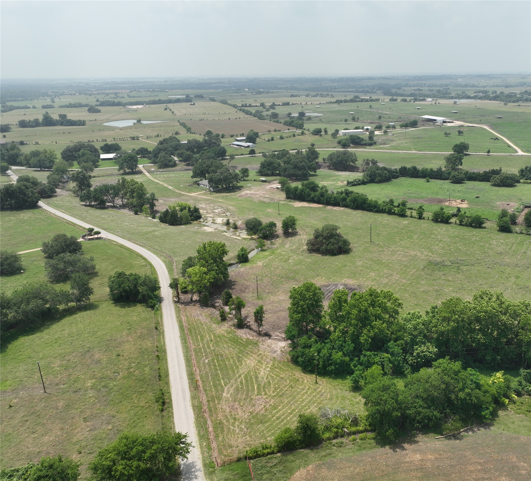 7009 Sandy Hill Road Brenham, TX 77833 - Photo 40 of 41 an aerial view of river residential houses with outdoor space and trees