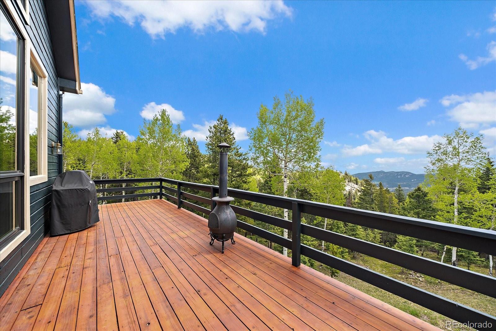 11222 Conifer Mountain Road Conifer, CO 80433 - Photo 11 of 49 a view of balcony with chairs