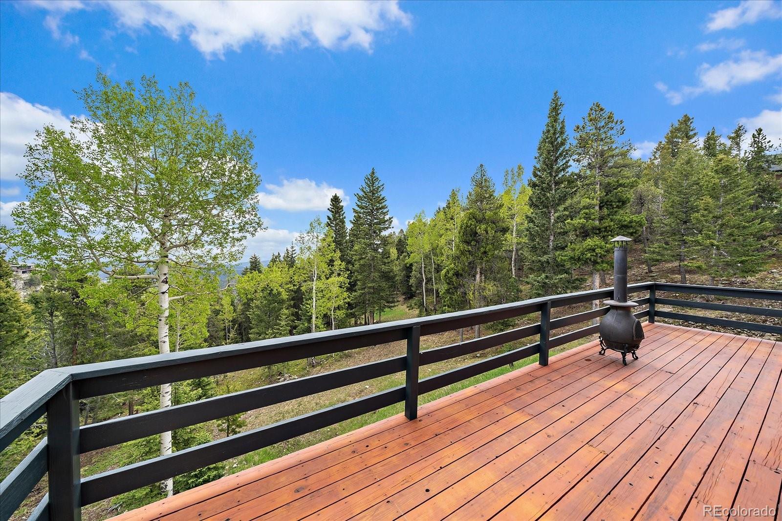 11222 Conifer Mountain Road Conifer, CO 80433 - Photo 12 of 49 a view of outdoor space with trees
