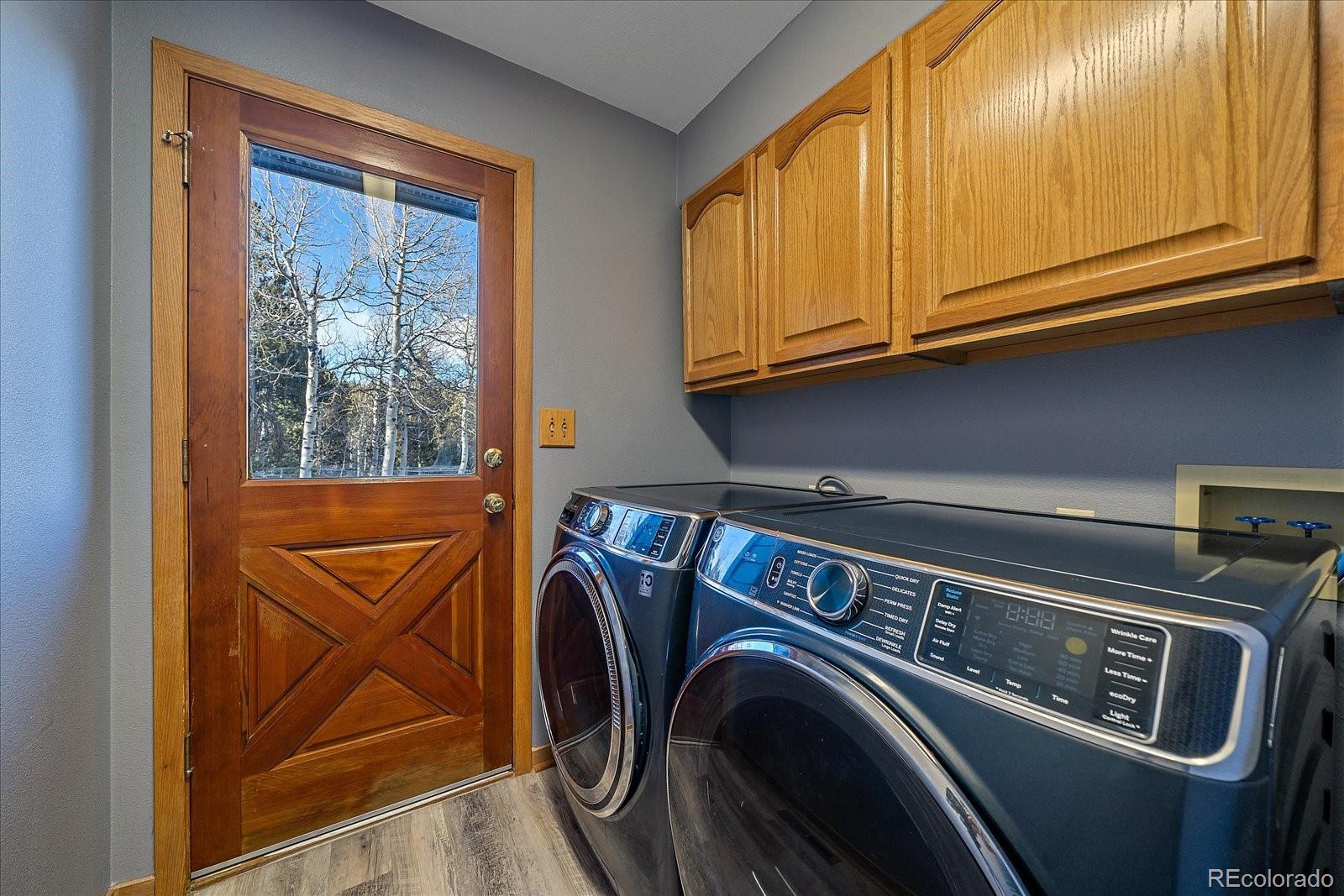 11222 Conifer Mountain Road Conifer, CO 80433 - Photo 23 of 49 a utility room with dryer and washer