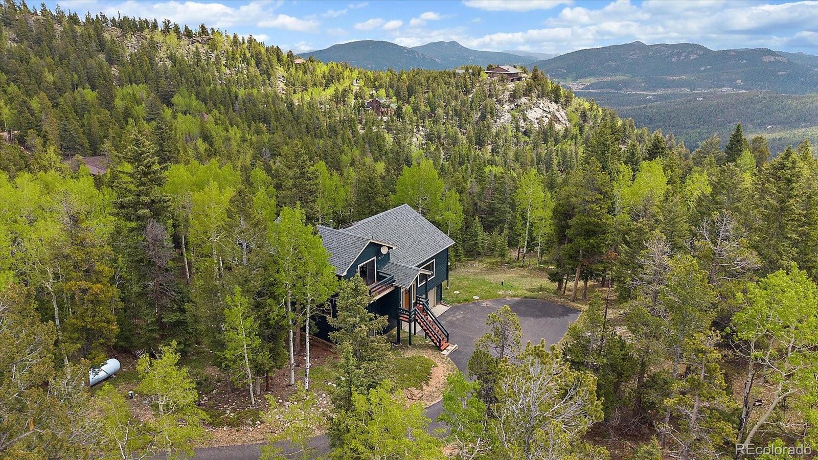 11222 Conifer Mountain Road Conifer, CO 80433 - Photo 42 of 49 a view of a yard