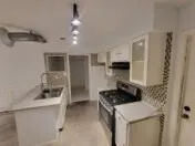 a kitchen with a sink and stove