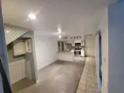 a view of a kitchen from the hallway