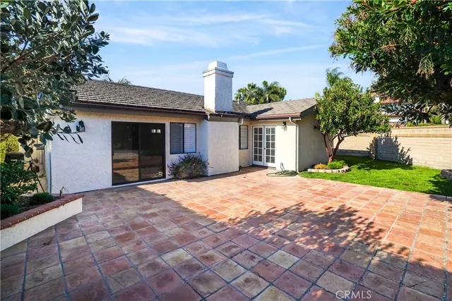 a front view of a house with a yard and a garage