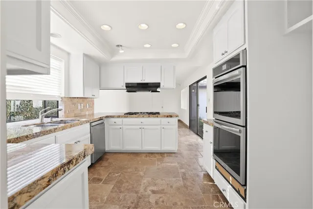 a kitchen with a sink microwave and refrigerator
