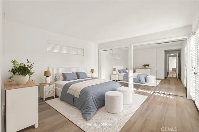 a spacious bedroom with a bed and a couch