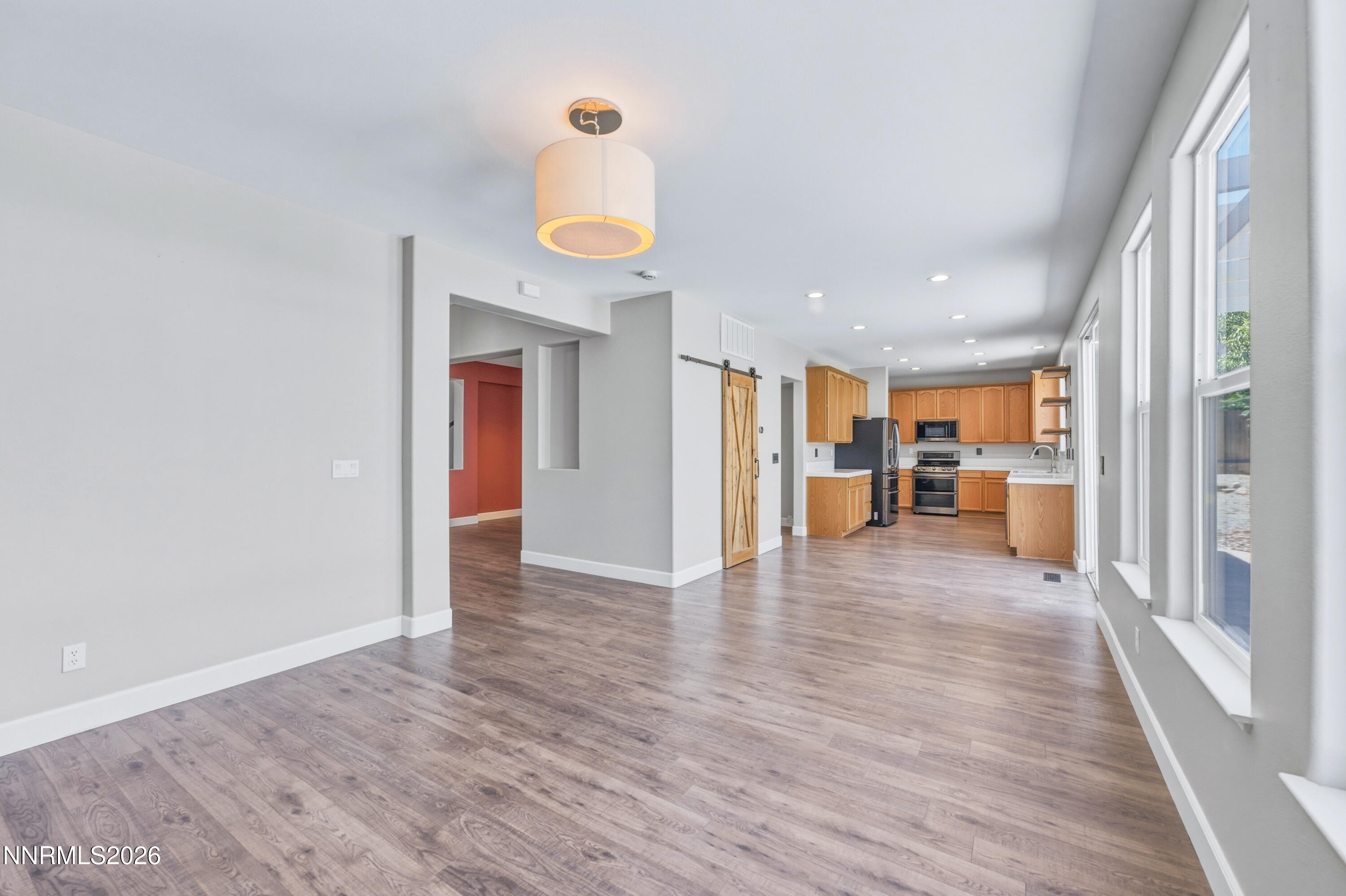 1770 Kodiak Circle Reno, NV 89511 - Photo 11 of 32 a view of a hallway with wooden floor and a kitchen