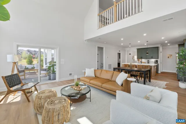 a living room with furniture and a table
