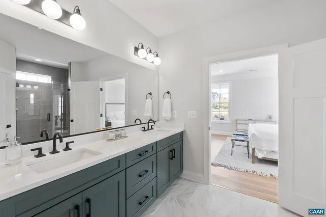 a spacious bathroom with a double vanity sink mirror and double
