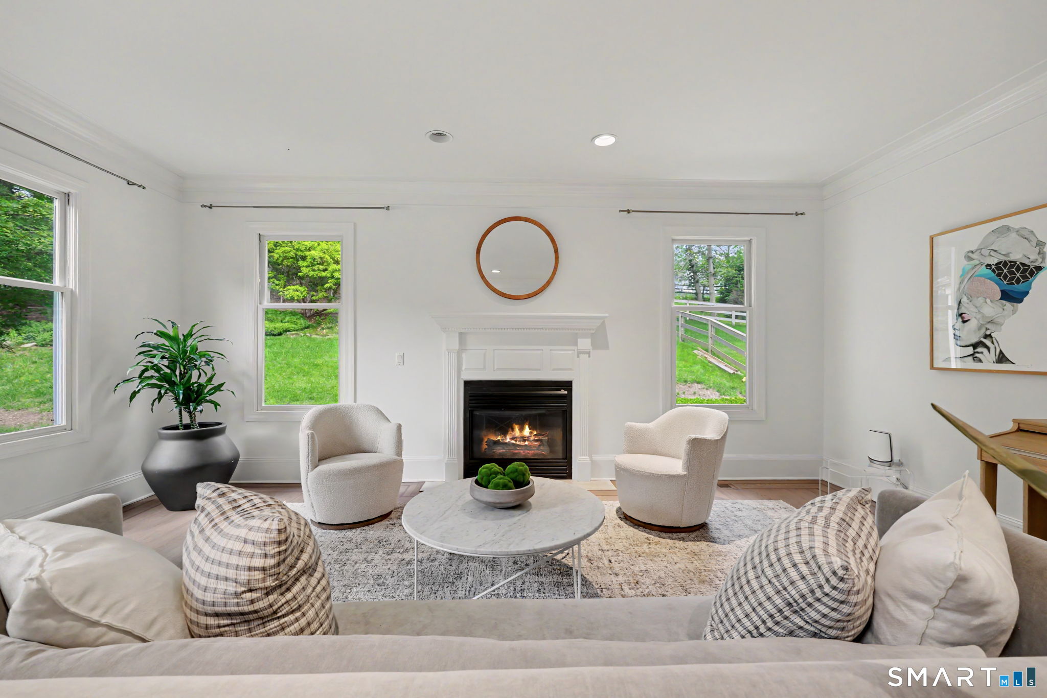 10 Side Hill Road Westport, CT 06880 - Photo 20 of 40 a living room with furniture a window and a fireplace