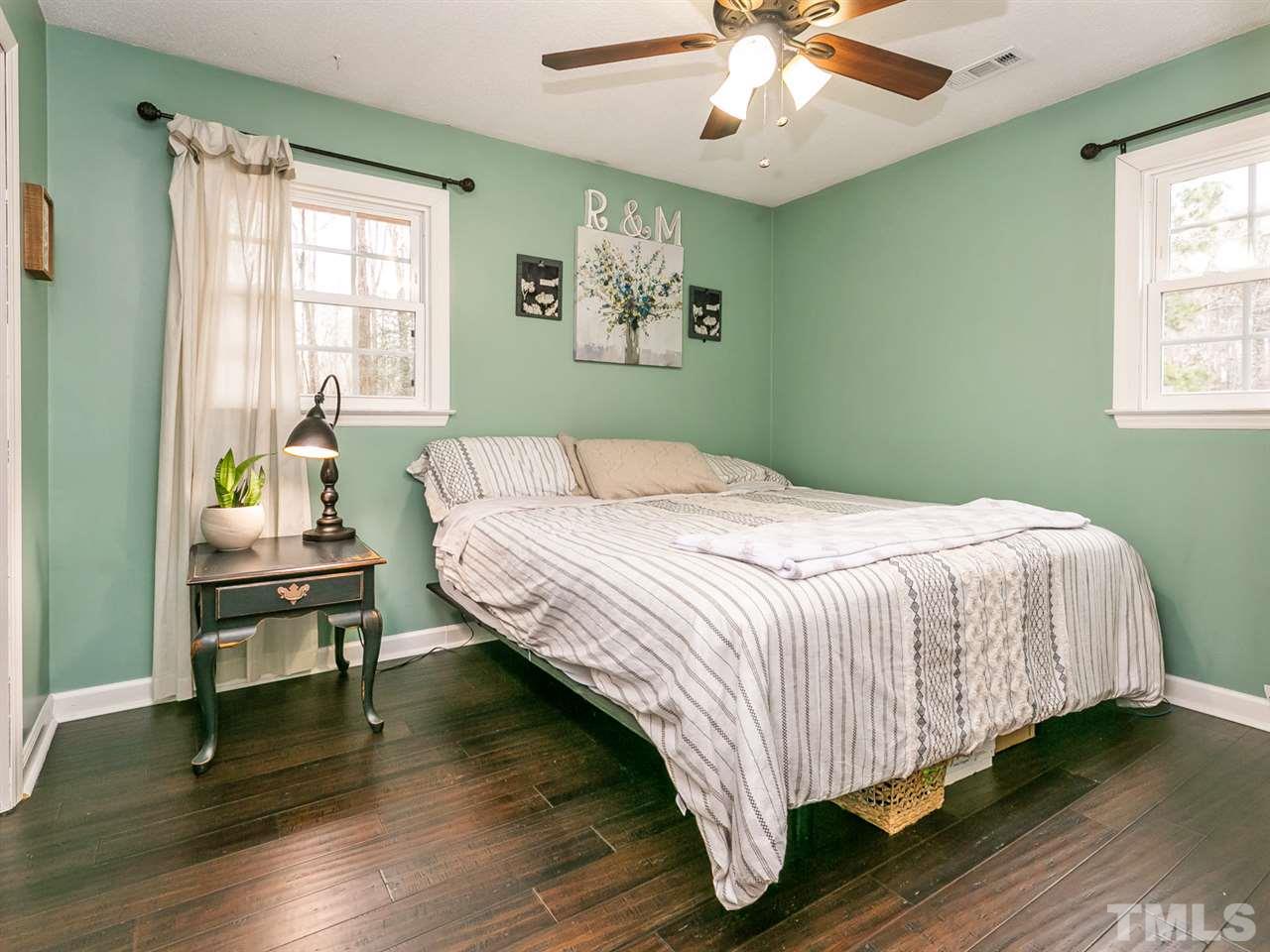 7532 Martin Road Zebulon, NC 27597 - Photo 12 of 26 a bedroom with a bed and window