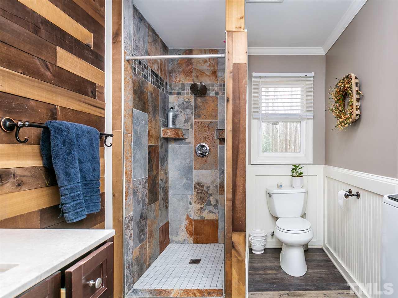 7532 Martin Road Zebulon, NC 27597 - Photo 16 of 26 a bathroom with a toilet and a shower