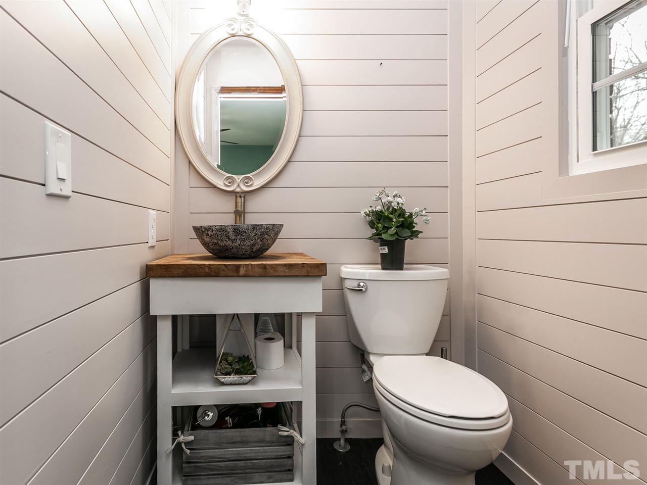 7532 Martin Road Zebulon, NC 27597 - Photo 19 of 26 a bathroom with a toilet and a sink