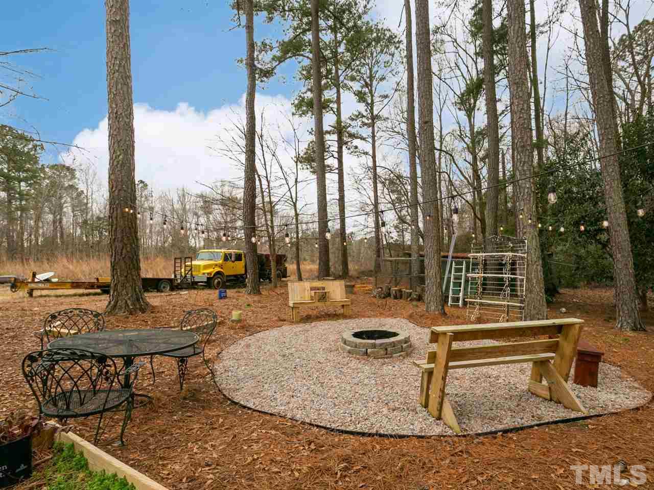 7532 Martin Road Zebulon, NC 27597 - Photo 24 of 26 a view of a swimming pool with chairs