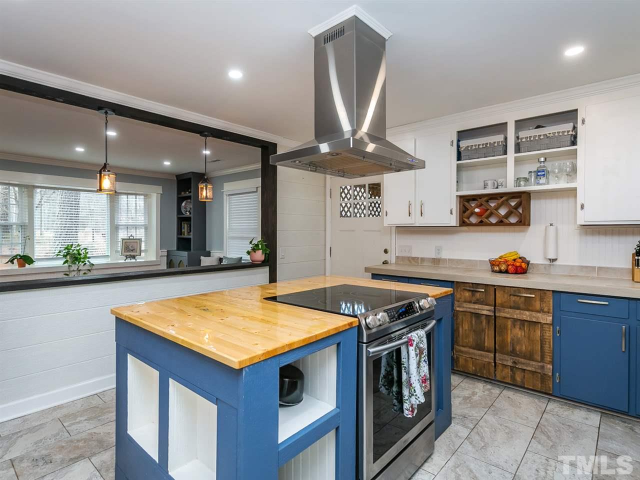 7532 Martin Road Zebulon, NC 27597 - Photo 8 of 26 a kitchen with stainless steel appliances granite countertop a stove and a sink