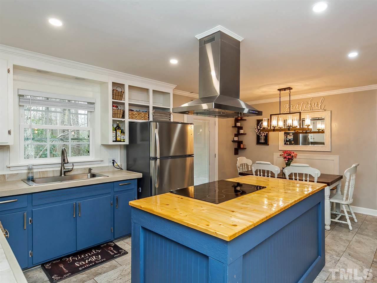 7532 Martin Road Zebulon, NC 27597 - Photo 10 of 26 a kitchen with refrigerator and sink