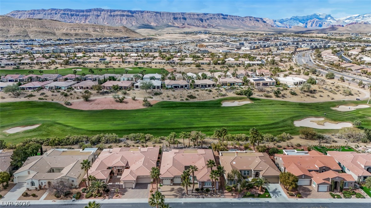 5015 Rivedro Street Las Vegas, NV 89135 - Photo 70 of 91 Overlooking verdant fairways, this residential enclave offers unparalleled mountain and golf course vistas.