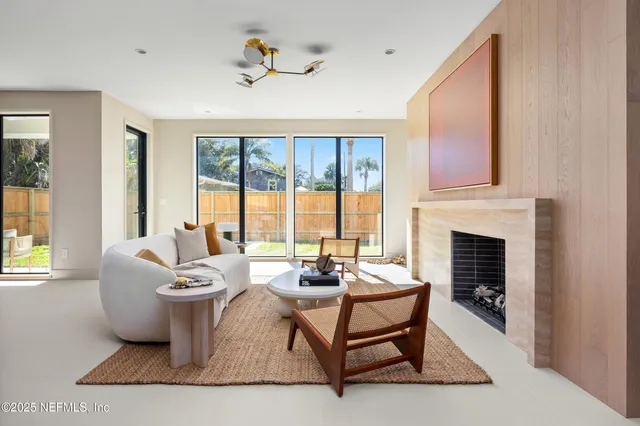 a spacious bedroom with a bed and a window