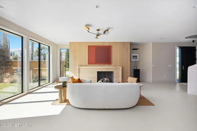 a spacious bedroom with a bed and a window