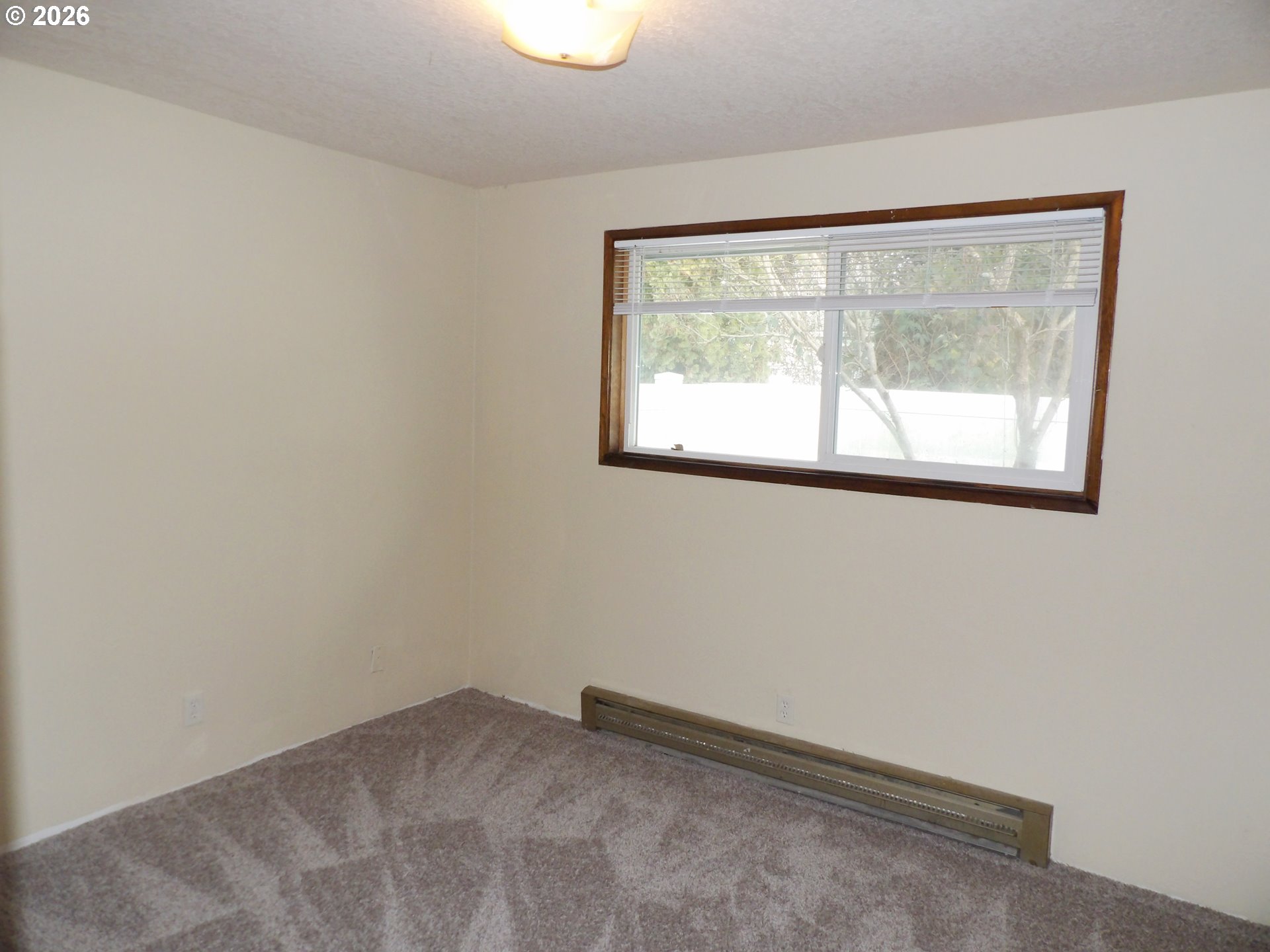 3124 19th Place Forest Grove, OR 97116 - Photo 27 of 31 an empty room with a window