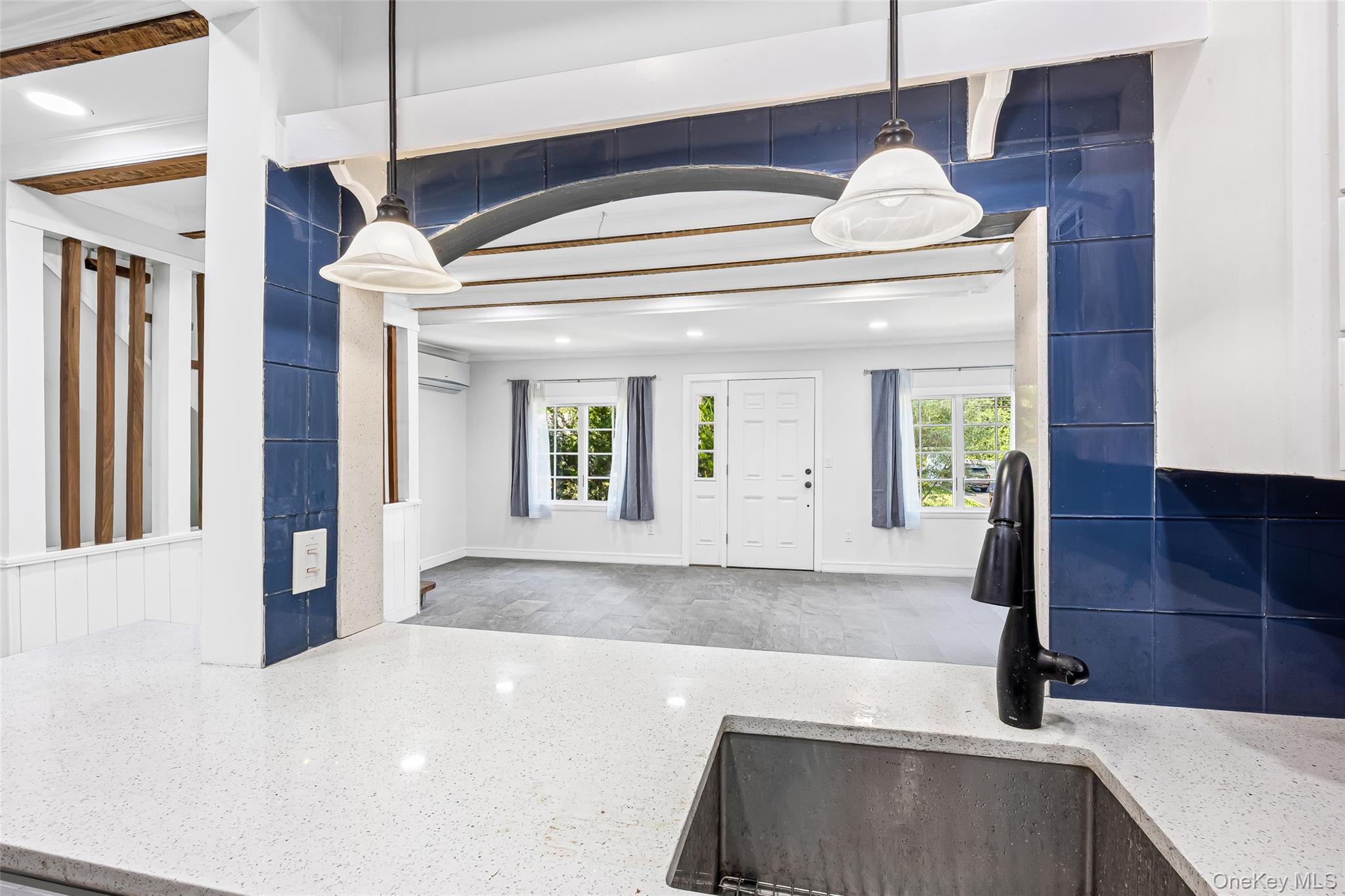 143 Rocky Point Landing Road Rocky Point, NY 11778 - Photo 12 of 43 a kitchen with a sink and a refrigerator