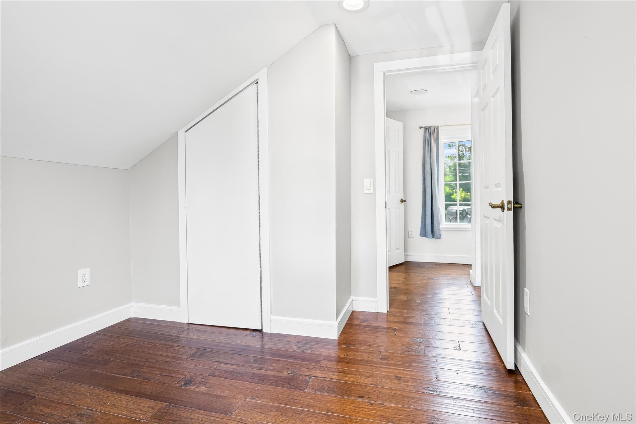143 Rocky Point Landing Road Rocky Point, NY 11778 - Photo 19 of 43 a view of a hallway with wooden floor