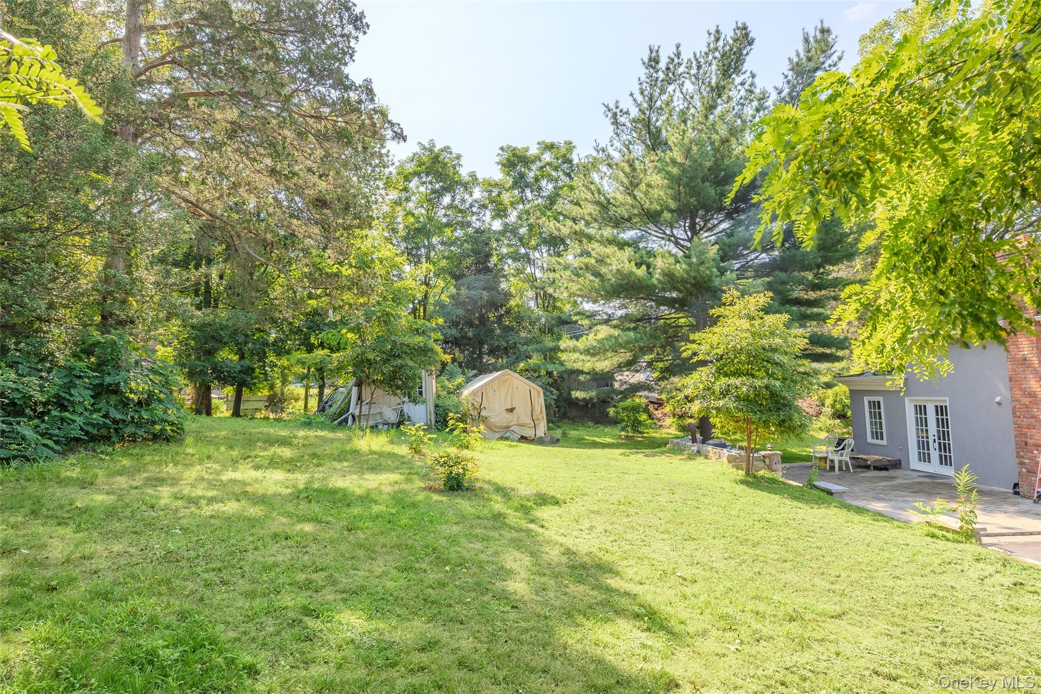 143 Rocky Point Landing Road Rocky Point, NY 11778 - Photo 28 of 43 a swimming pool with some trees in the background