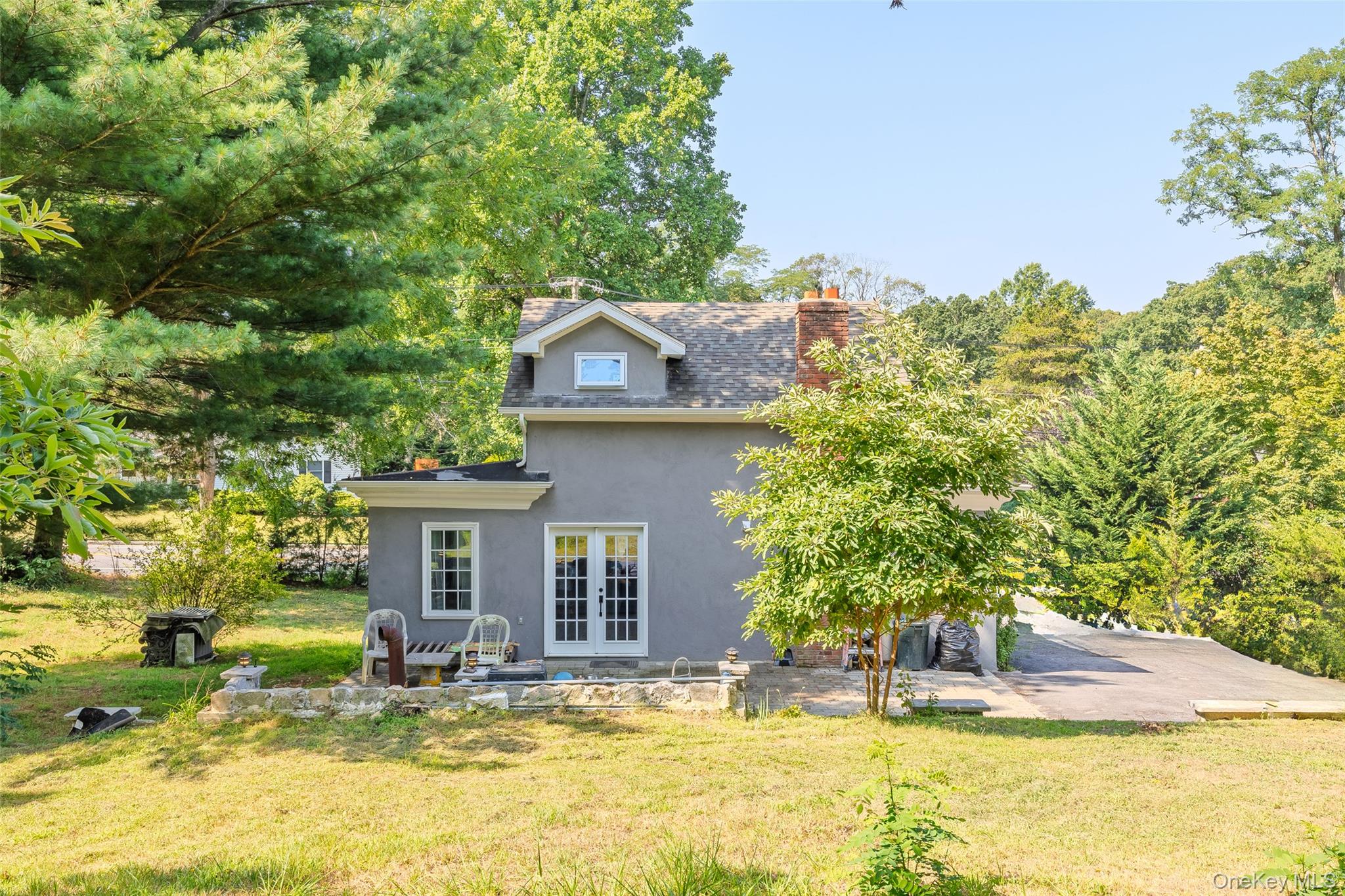 143 Rocky Point Landing Road Rocky Point, NY 11778 - Photo 29 of 43 a view of a house with swimming pool and sitting area