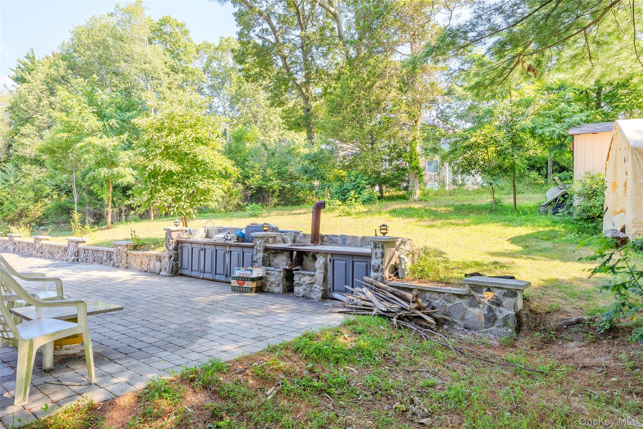 143 Rocky Point Landing Road Rocky Point, NY 11778 - Photo 30 of 43 a view of a house with backyard porch and sitting area