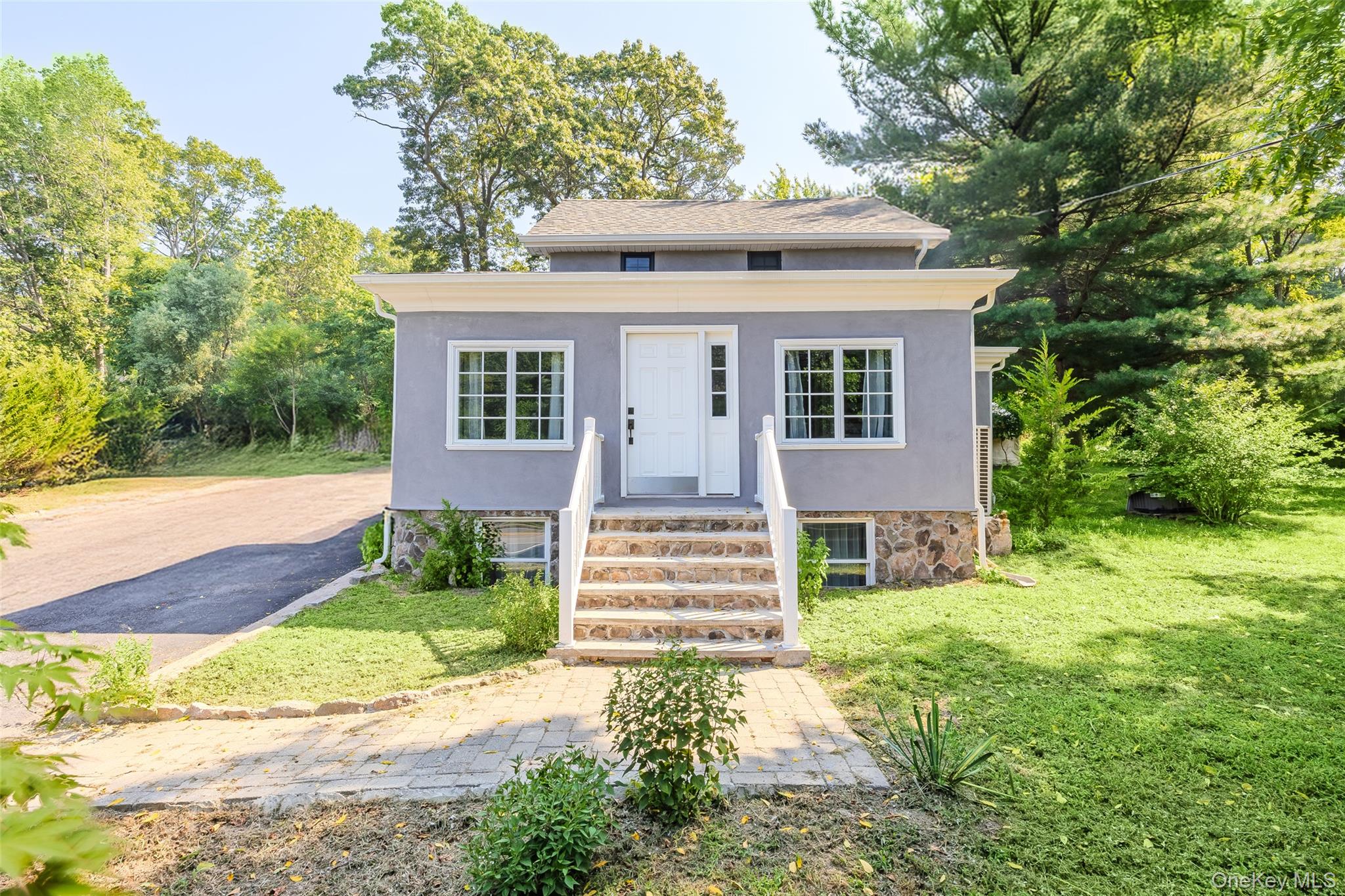 143 Rocky Point Landing Road Rocky Point, NY 11778 - Photo 3 of 43 a front view of a house with a yard