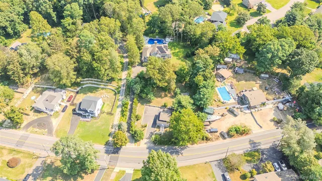 a view of a green field with lots of bushes