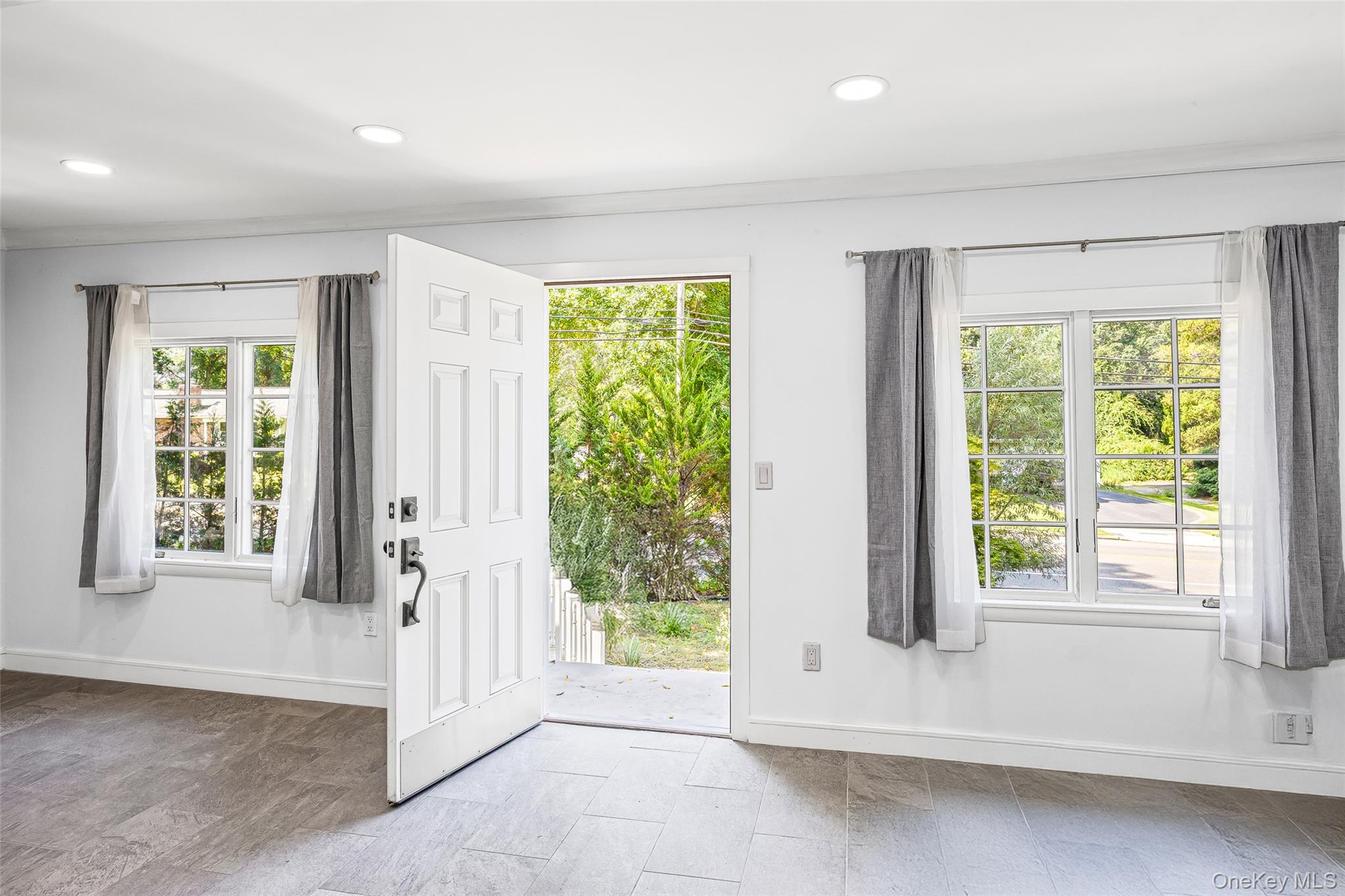 143 Rocky Point Landing Road Rocky Point, NY 11778 - Photo 4 of 43 a view of an empty room with a window
