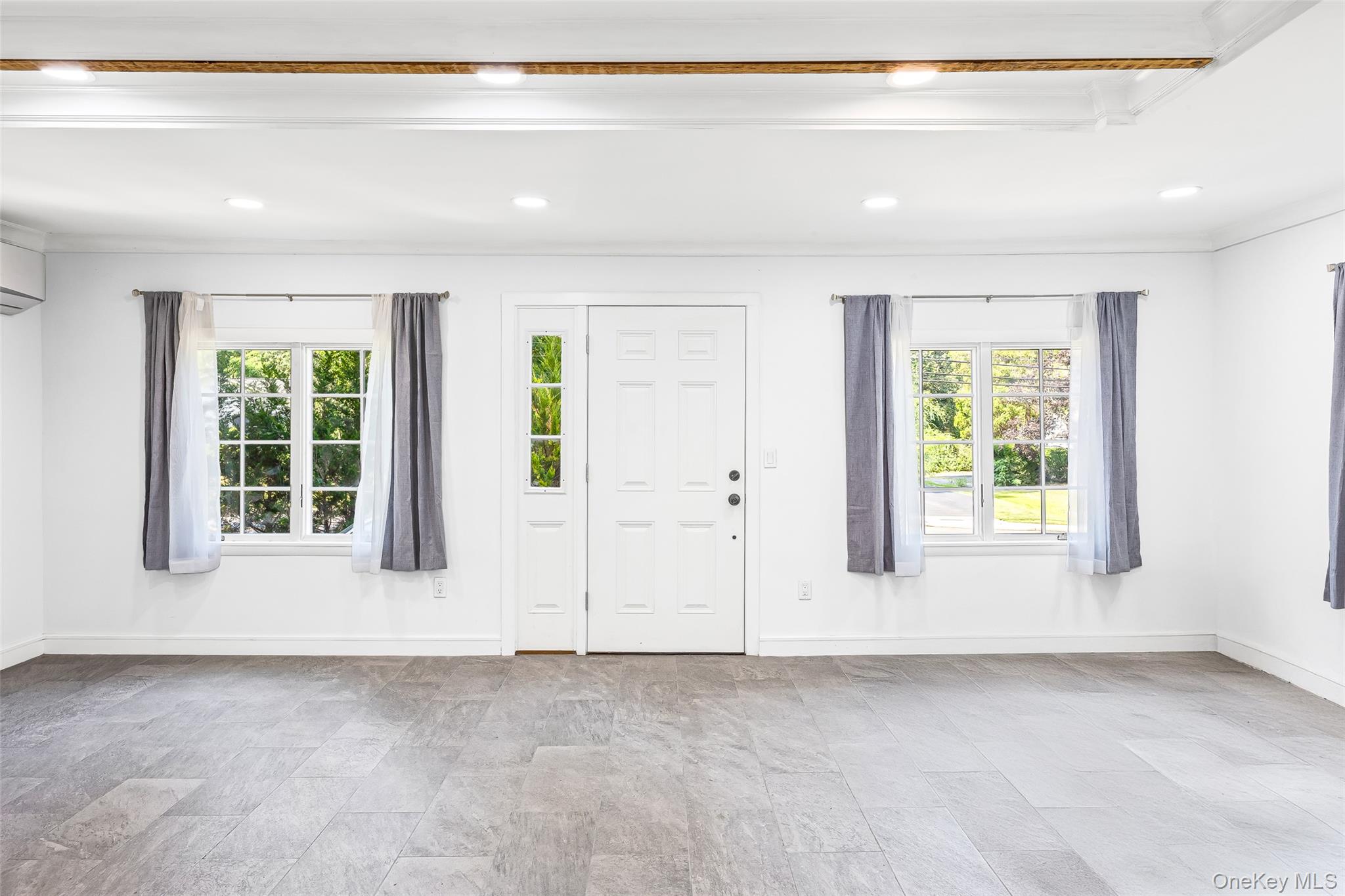 143 Rocky Point Landing Road Rocky Point, NY 11778 - Photo 5 of 43 a view of an empty room with window