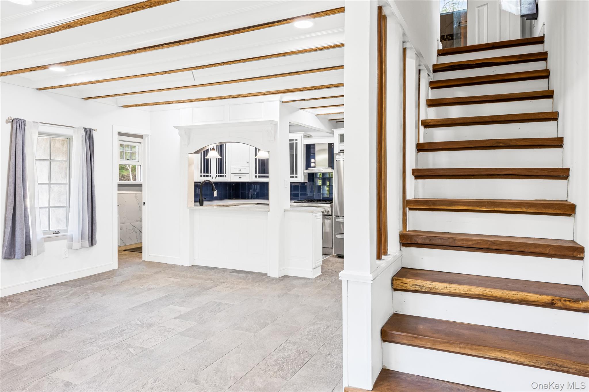 143 Rocky Point Landing Road Rocky Point, NY 11778 - Photo 8 of 43 a view of a livingroom with wooden cabinets and a window