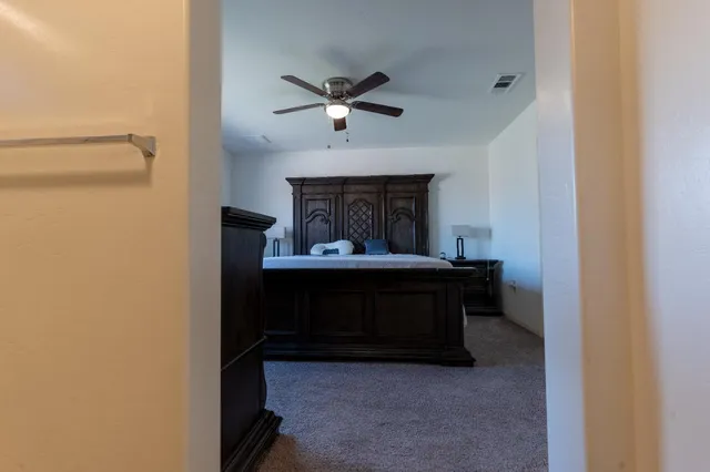 a bed sitting in a room next to a window