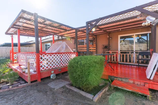 a view of a backyard with sitting area