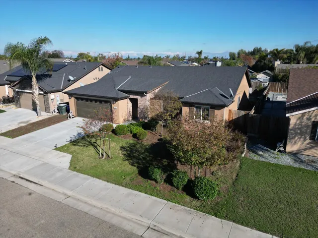 an aerial view of a house with a garden