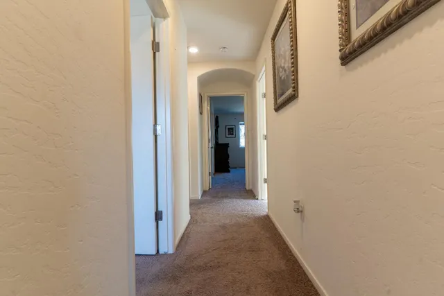 a view of a hallway with a white walls