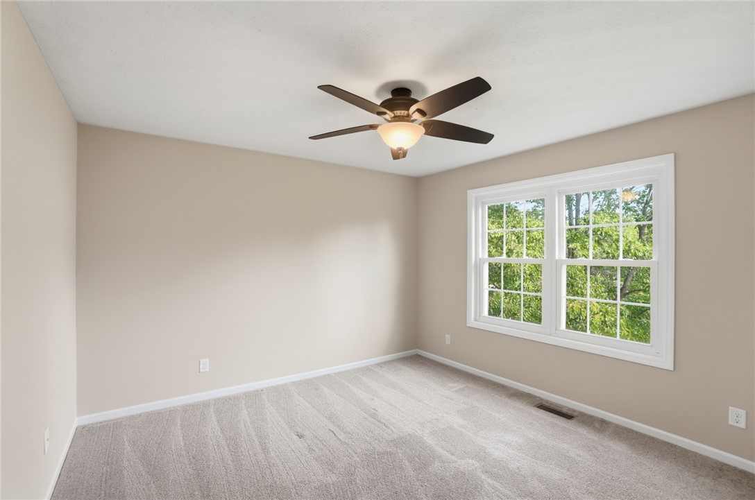 10 Chase Court Springboro, OH 45066 - Photo 44 of 75 Bright and airy room with lush green views, creating a serene and inviting atmosphere.