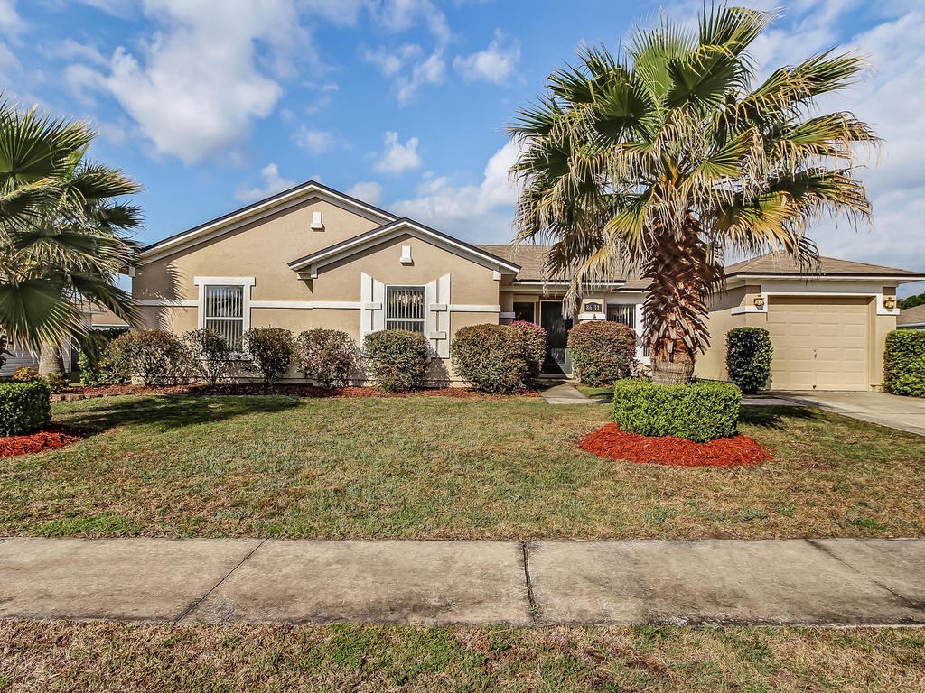 a front view of a house with a yard