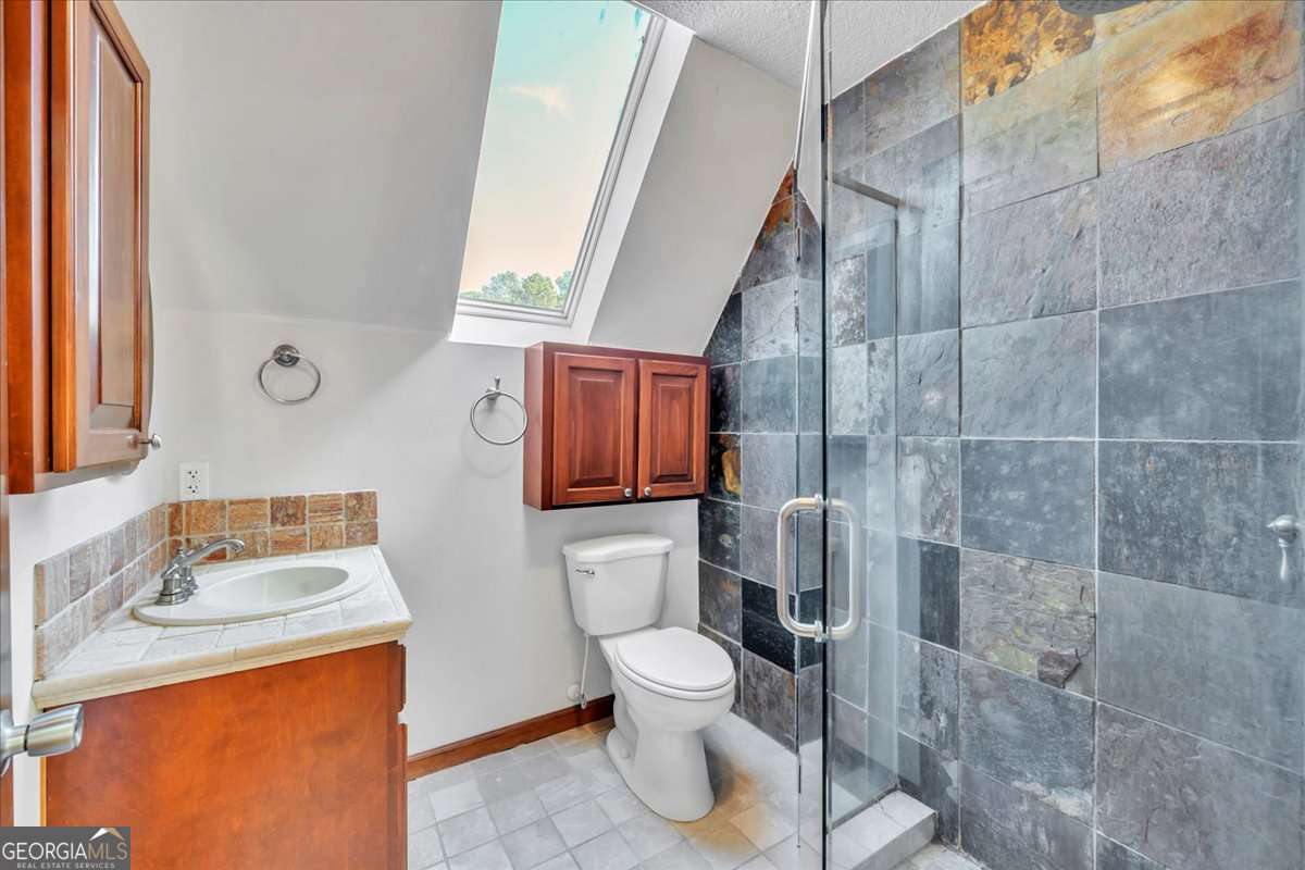 11157 Cannonville Road Rochelle, GA 31079 - Photo 24 of 38 a bathroom with a toilet sink and mirror