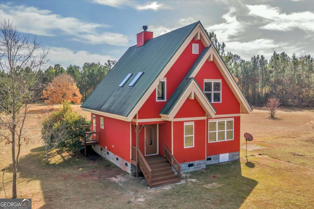 11157 Cannonville Road Rochelle, GA 31079 - Photo 29 of 38 a view of a house with a yard