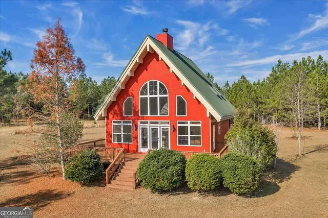 a view of front of house with a yard