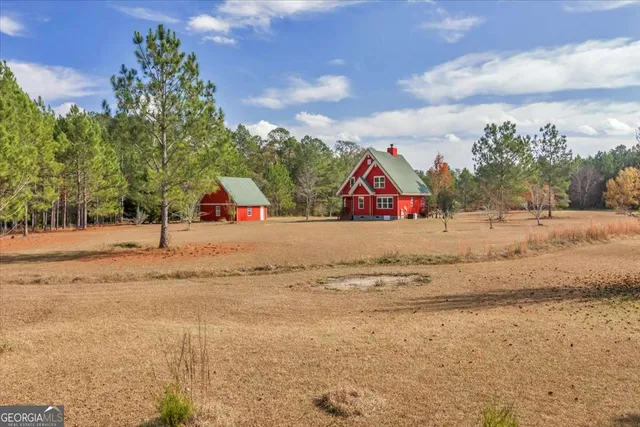 an aerial view of a town with couple of houses