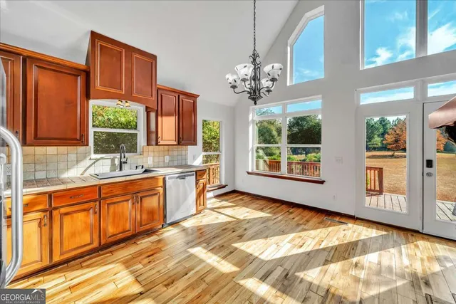 a view of a kitchen with a sink and windows