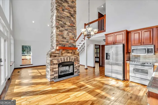 a view of livingroom with furniture fire place and refrigerator