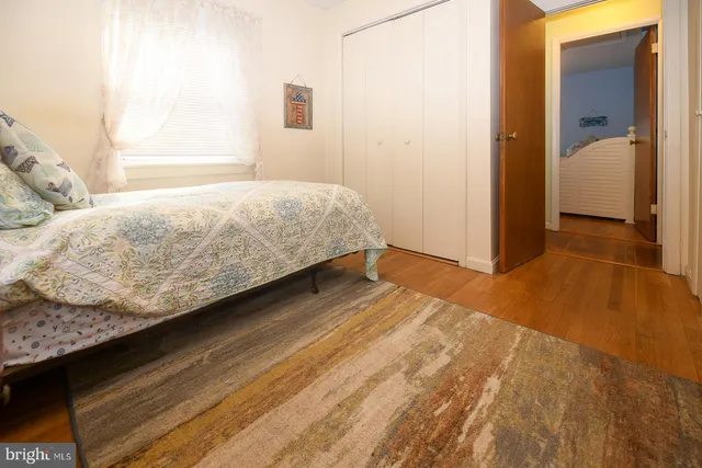 a bedroom with a bed and walk in closet