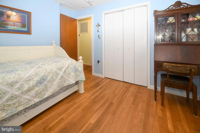 a bedroom with a bed and a table