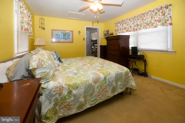 a bedroom with a bed and cabinets